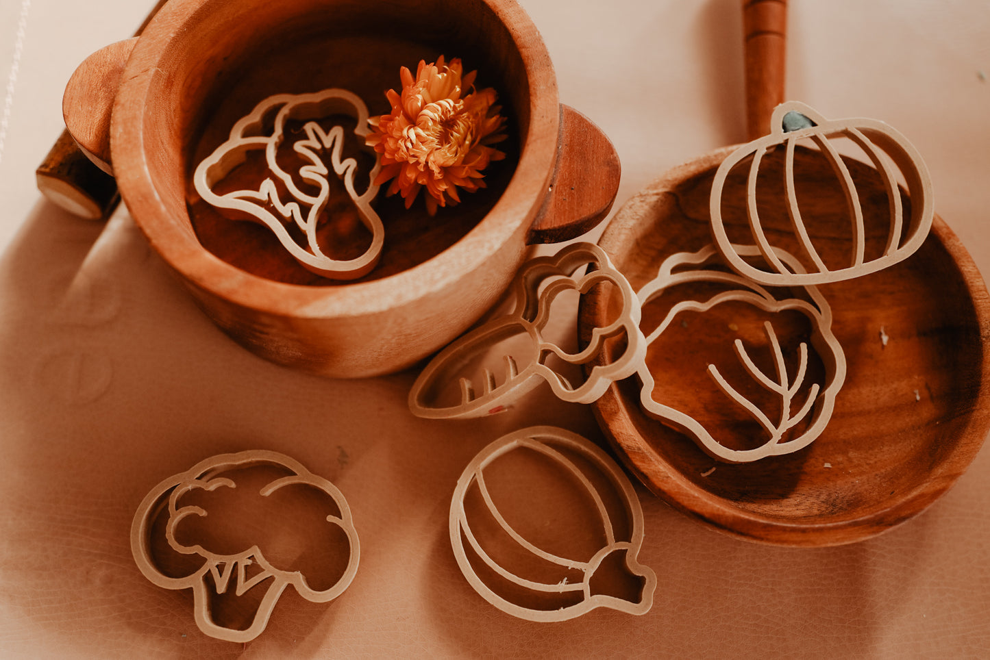 Kinfolk Pantry eco vegetable shaped playdough cutters. A pretend kitchen has been set up and the vegetable playdough shapes created have been added to the pots and pans.