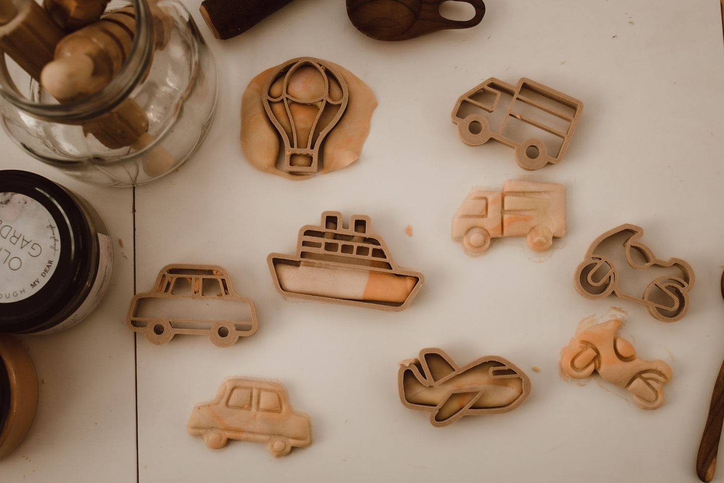 Kinfolk Pantry eco playdough cutters - a set of 6 transport themed biodegradable cutters for kids arts and crafts. Image shows each cutter being used to make the shapes in playdough.